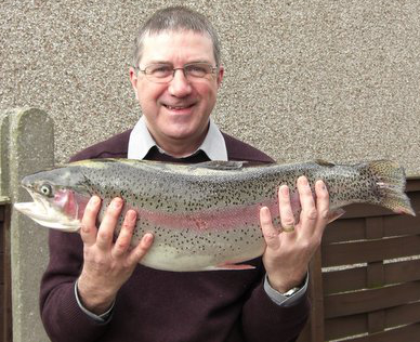 Dennis Hamilton caught the biggest fish ever taken from Monikie waters on April, 2010.
The 10 lb 12 oz monster took a Green and Black Goldhead on the Island Pond near the Craigton Bank.